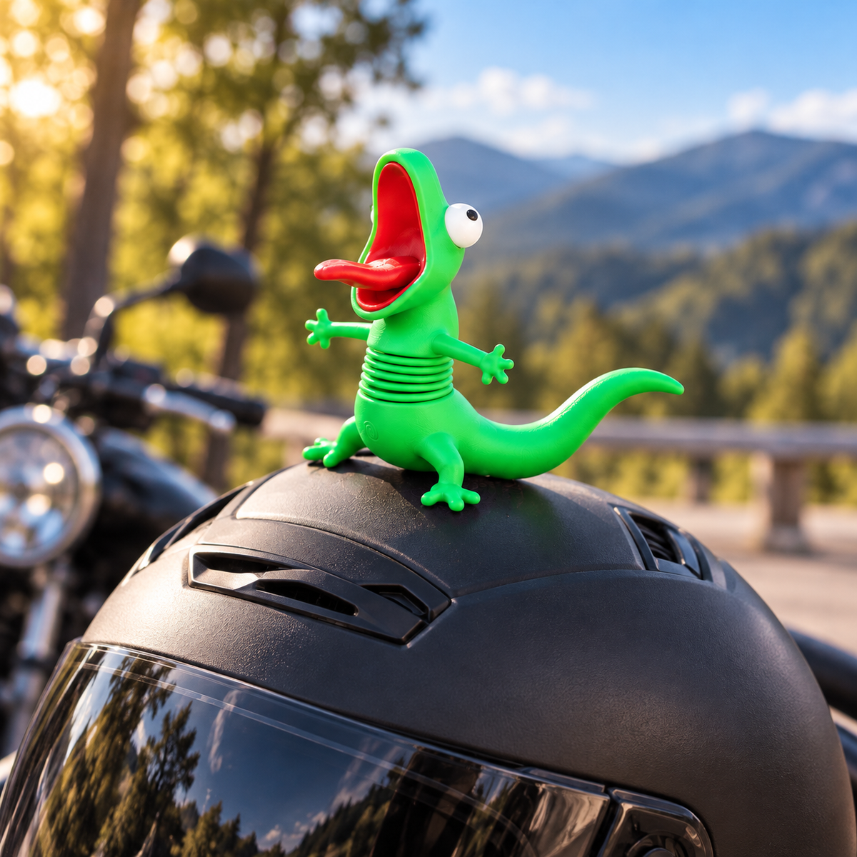 Funny green spring lizard bobblehead figurine with wide-open mouth displayed on a black motorcycle helmet outdoors.